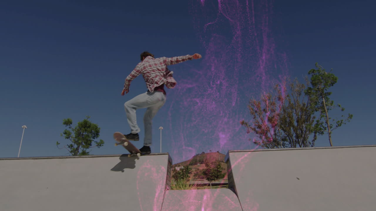 Male skateboarder performing ollie trick in skatepark, showcasing tech-driven purple-pink effect