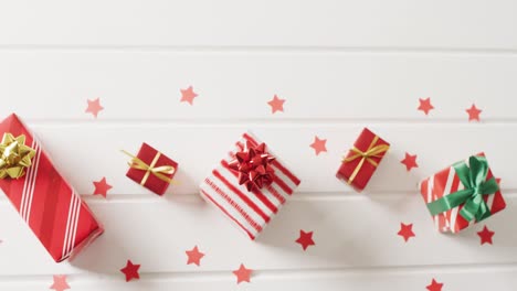 video of christmas gifts with christmas decoration and copy space on white background