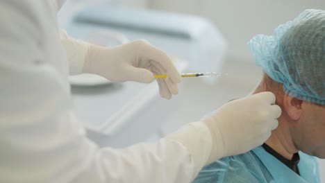 a doctor administering botulinum injections to a patient as a treatment for bruxism and spasticity. the clinical setting emphasizes professionalism and medical expertise