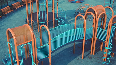 empty swings on summer kids playground