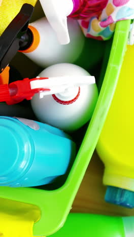 various housekeeping supplies in a bucket