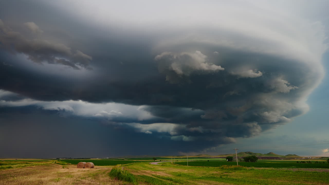 Ominous Supercell Storm Cloud Over Rural Landscape with RV