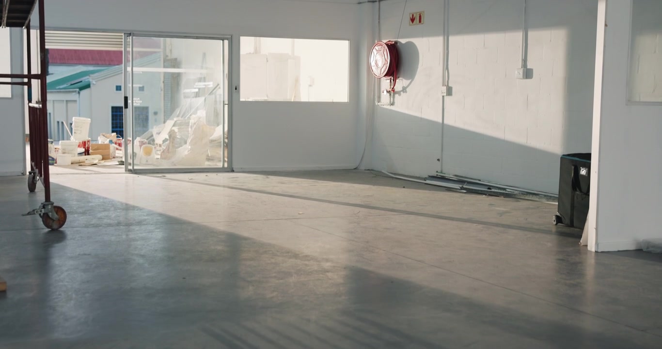 Empty Industrial Warehouse Space with Natural Sunlight