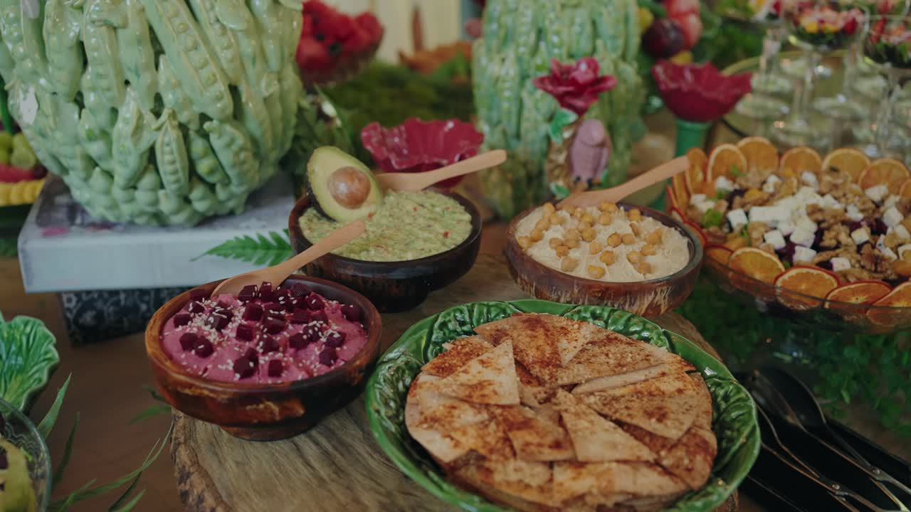 vibrant mix of dips pita and salad served on rustic decorative table