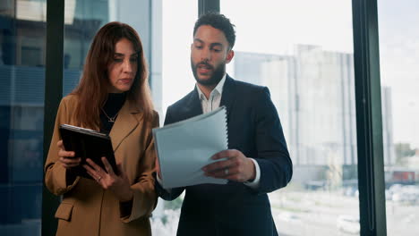 business colleagues discussing work in an office