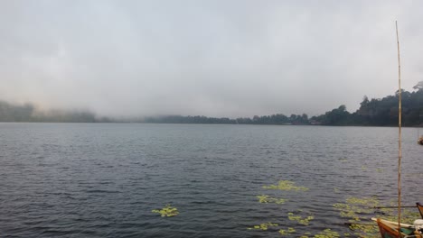 panoramic view of beratan lake bali indonesia foggy skyline sunset at green hill in volcanic landscape, southeast asia