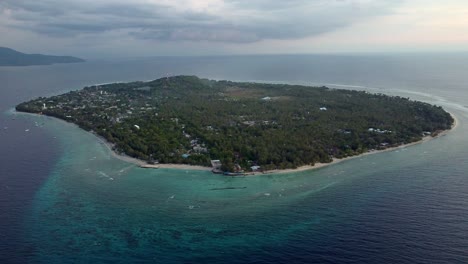 Aerial-of-remote-isolated-little-island-in-the-middle-of-the-ocean,-holiday-destination-gili-trawangan-indonesia