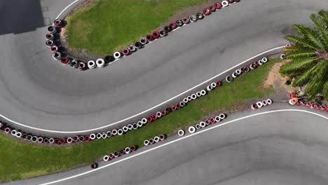 Aerial view of a go-kart track with tire barriers
