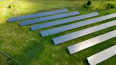 Aerial-view-of-solar-power-station,-Aerial-Top-View-of-Solar-Farm-with-Sunlight,-Renewable-Energy,-Aerial-shot-of-Solar-Power-Station-daytime