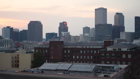 Window-Seat-View-of-Crescent-City-Connection-Bridge-Downtown-of-New-Orleans,-Louisiana-with-Colorful-Skyline-Background