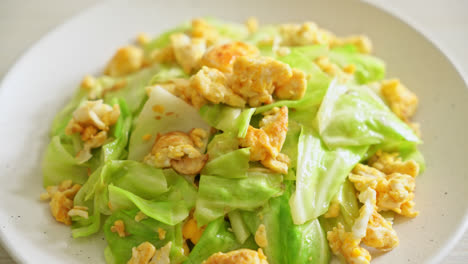 homemade stir-fried cabbage with egg on plate