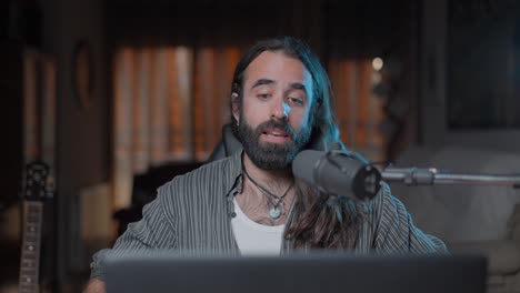man recording podcast or streaming session in home studio