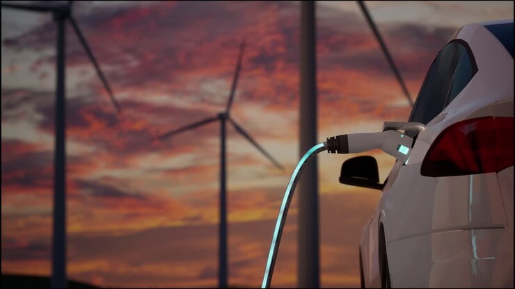 экологически чистый электрический автомобиль зарядка на фоне ветряных турбин. вечерний закат вид ev станции с портом подключенным к автомобилю. реалистичный 3d-рендеринг концепции альтернативной энергии