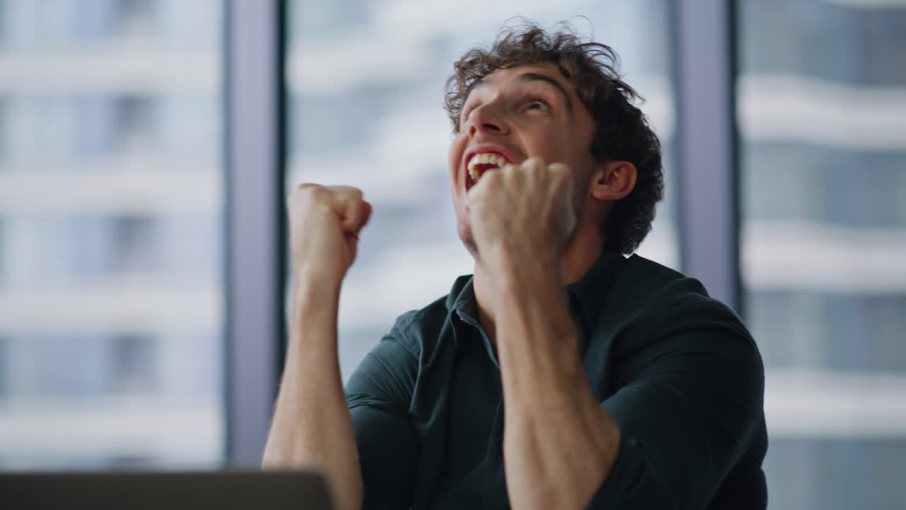 Overjoyed freelancer feeling success reading great news at laptop closeup