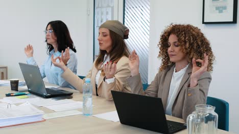 business people working with hologram concept. group of women meditate during a break at a holographic work and business meeting