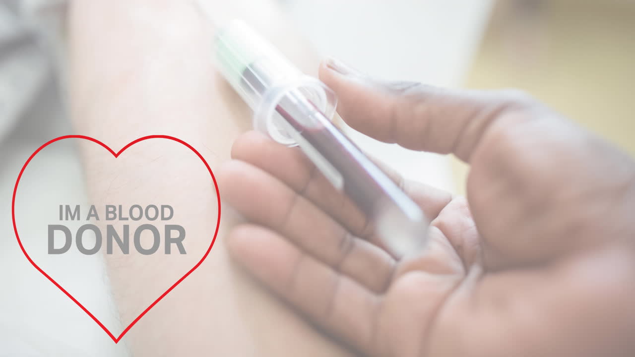 Animation of im a blood donor text over doctor taking blood sample