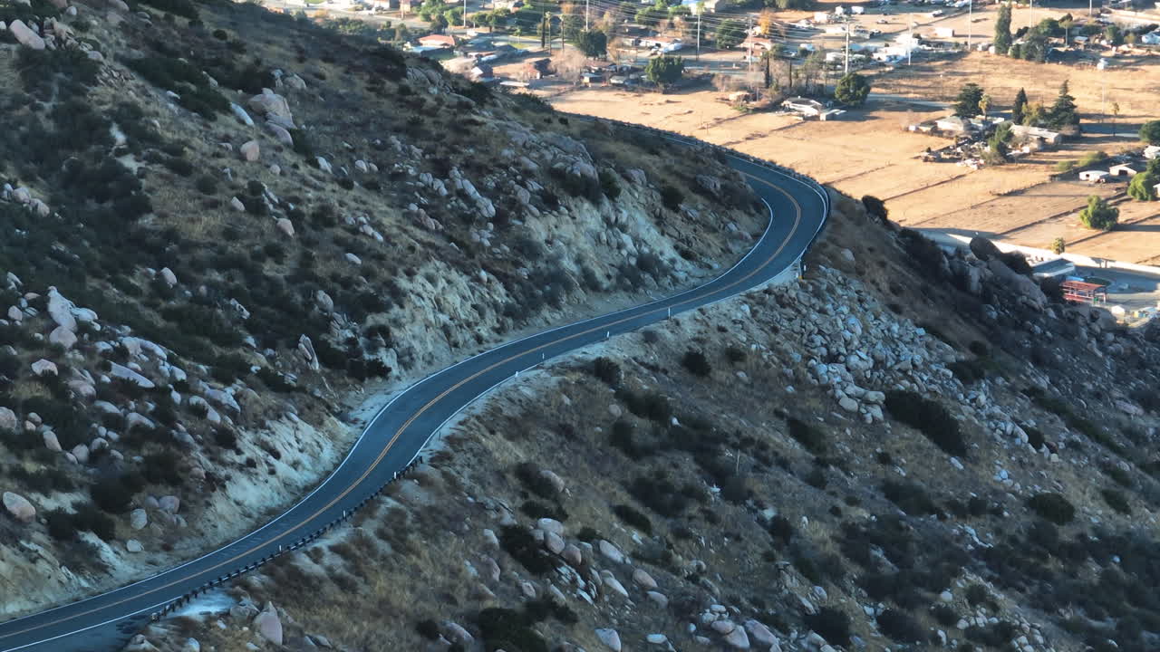 Telephoto drone shot of a road in the San Bernardino mountains of Los Angeles