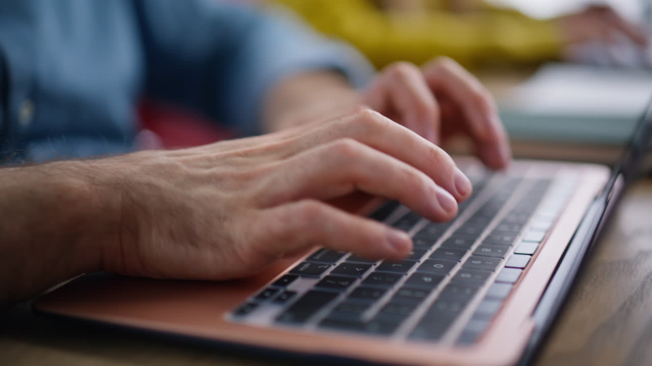 Unmotivated managers typing laptops at coworking office. Tired employee looking