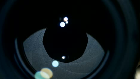 camera prime lens. close up of opening camera aperture