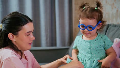 a heartwarming moment of care: a child playfully pampering her mother with gentle touches while bonding at home