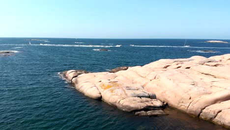 aerial drone shot flying over a boat race on the sea in bohuslan, sweden