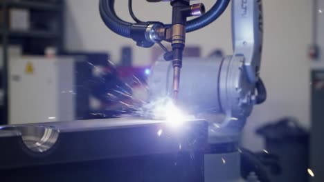 advanced robotic welding demonstration: precision metal joining process captured in two frames, showcasing the innovation of automated systems in manufacturing
