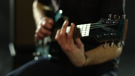 close up of man playing electric guitar shot on r3d