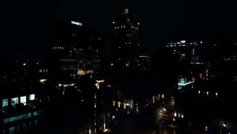 Rising-aerial-shot-in-milwaukee,-wisconsin,-USA-featuring-Chase-Bank-Logo-at-night