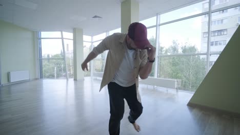 man breakdancing in modern studio