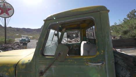 slow pull trough of an abandoned weathered green pickup truck cab, eldorado canyon nelson, nevada