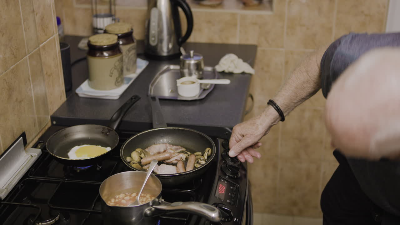 Man cooking breakfast in the kitchen