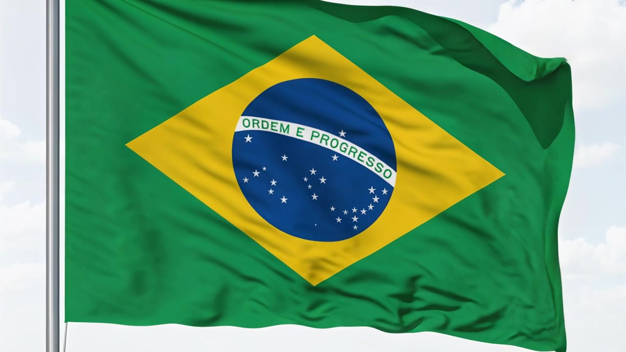 Vento aumentando, bandeira brasileira tremulando e revelando ORDEM E PROGRESSO no mastro, com nuvens leves