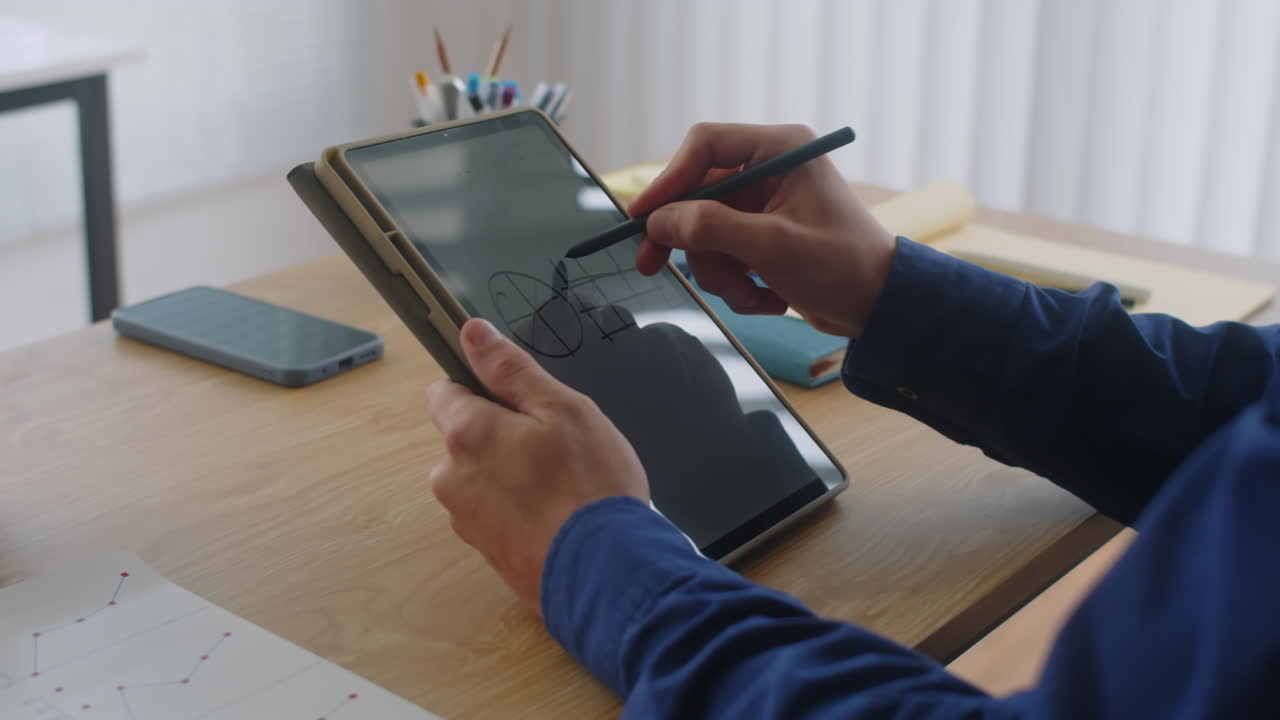 Employee Writing on Tablet with Pen Cropped Shot