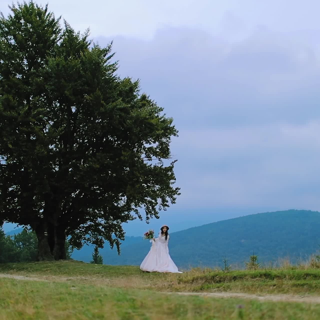 Woman posing over landscape of mountains