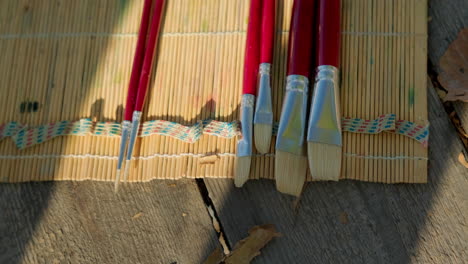 paintbrushes on bamboo placemat