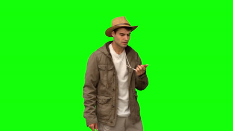 lost man using a compass on green screen