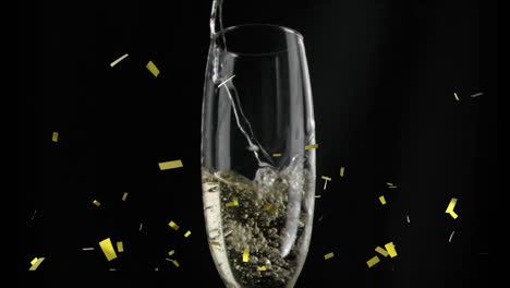 Animation-of-gold-confetti-falling-over-chmpagne-glass-on-black-background