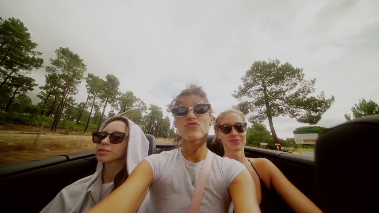 Three women driving in a car