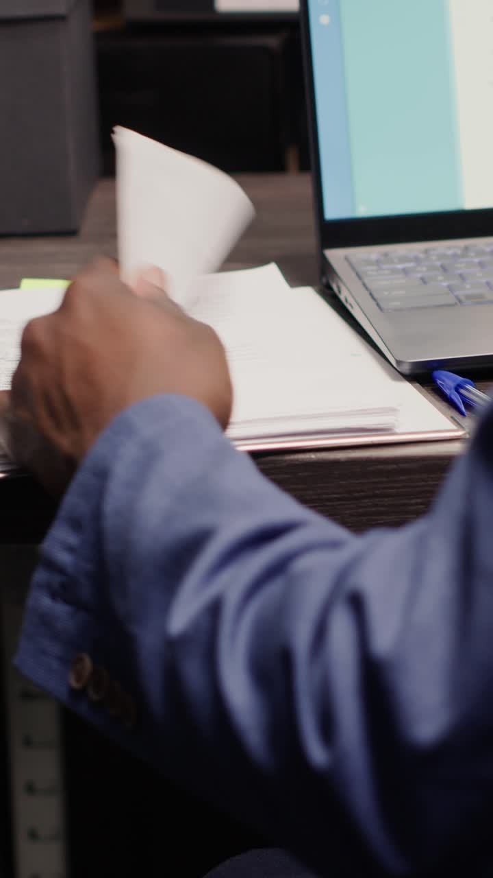 Typing on laptop with medical records software