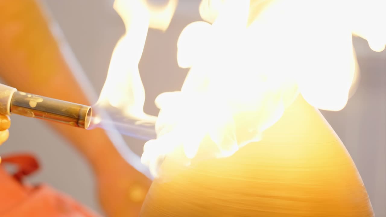 Pottery Artist Firing a Vase