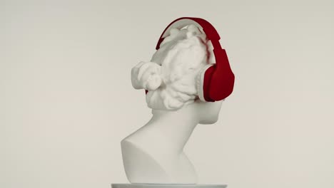 ancient sculpture with headphones