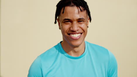 face, fitness and black man by wall in city