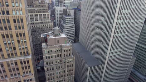 aerial birds eye overhead top down view of tall office of apartment buildings