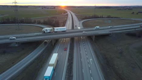 aerial view of freeway intersection with moving traffic cars