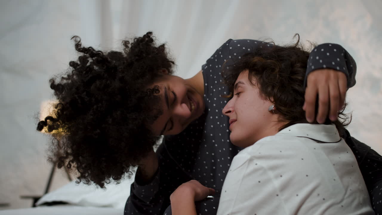 Happy couple together in the bedroom