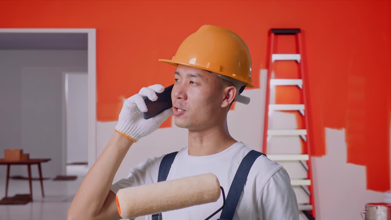 Painter on a phone call during home renovation