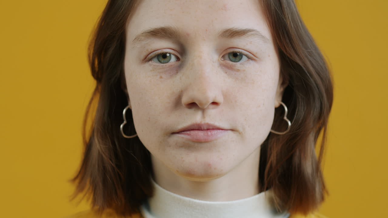 Woman with various facial expressions on yellow background