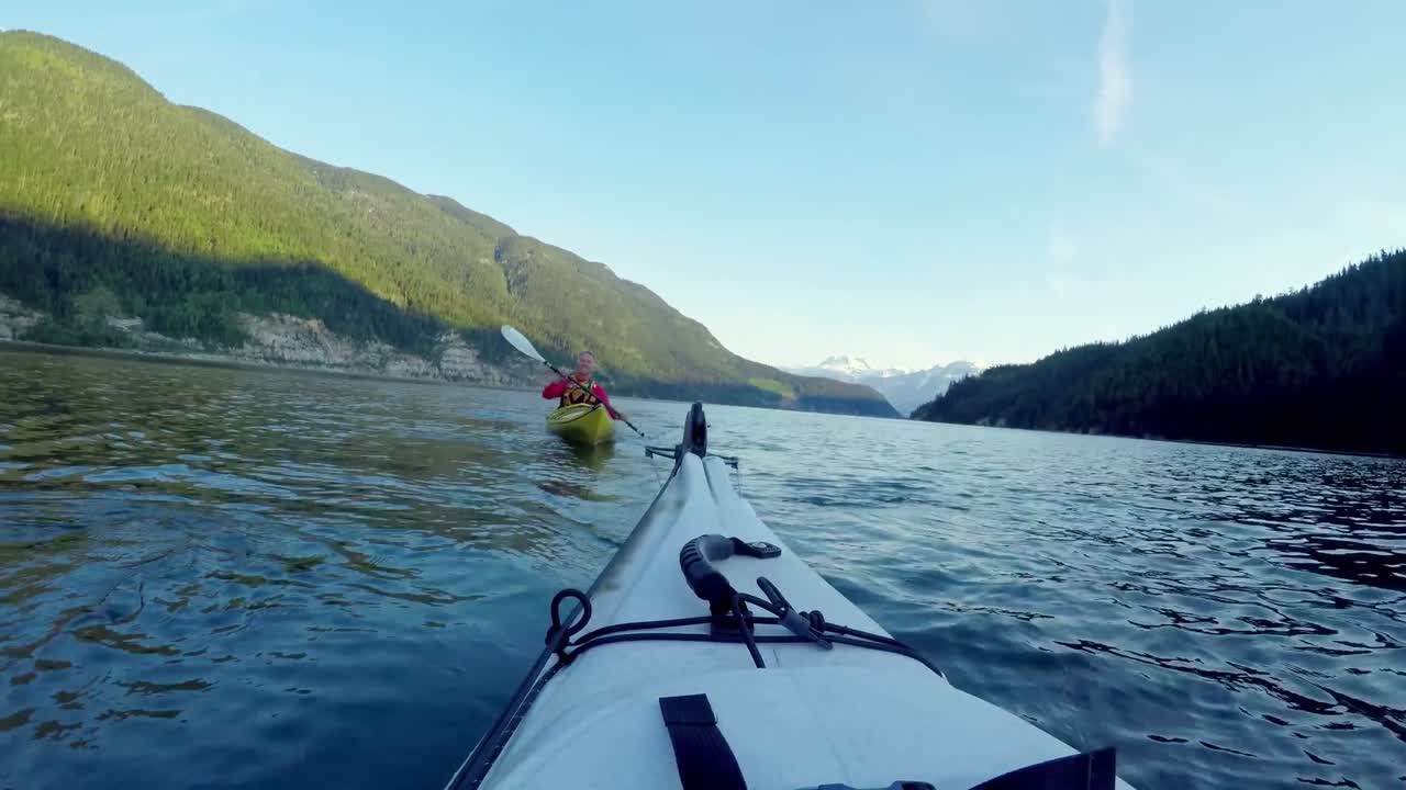 Tourist rowing a boat in the river 4k