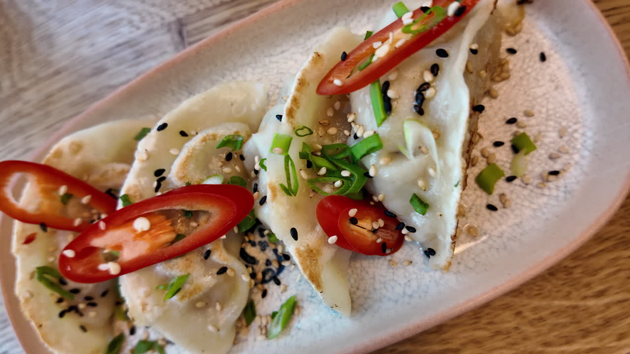 Gyoza chicken food with chilly pepper in a restaurant