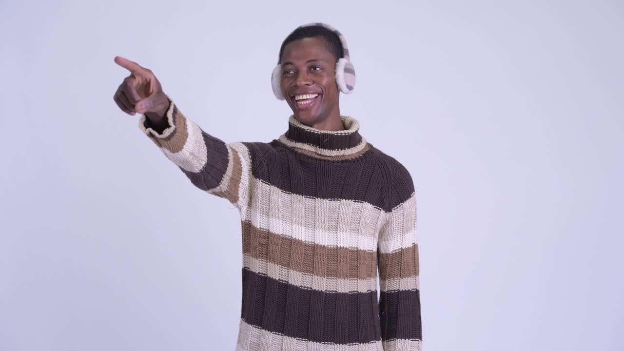 Young handsome African man ready for winter